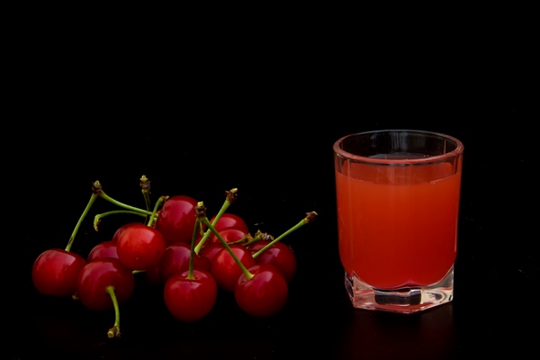compote with cherries and mint on a black background - Фрукты, ягоды