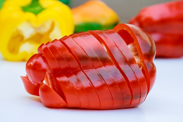 sliced red pepper on a white background - Салат «Мазурка»