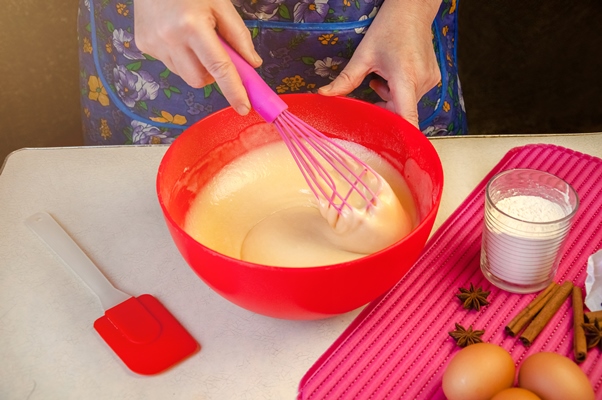 baking ingredients and utensils for cooking sponge cake process cooking sponge cake woman mixing the dough 1 - Пасхальный агнец