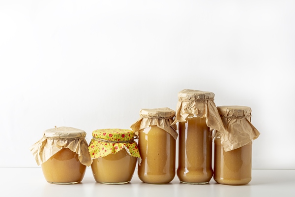 canned and preserved applesauce in glass jars fruit puree - Постные блинцы на яблочном пюре