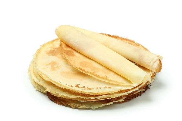 crepes or thin pancakes isolated on white background - Постные блинчики со свёклой и авокадо