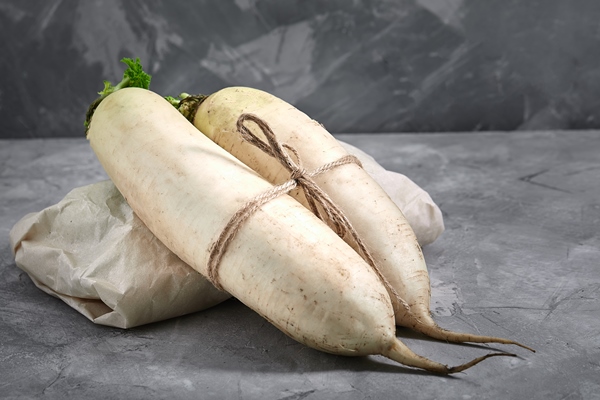 daikon radish on concrete background with space for text natural products gray background - Салат «Освежающий»