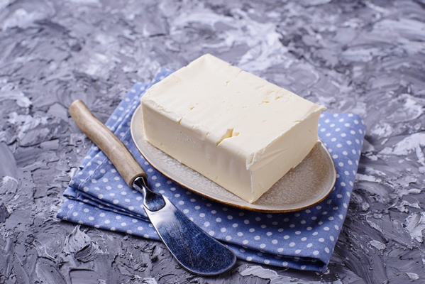 fresh butter and knife on concrete background - Пасха обыкновенная старинная