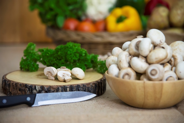 fresh champignon mushroom vegetable in the kitchen - Солянка грибная на зиму
