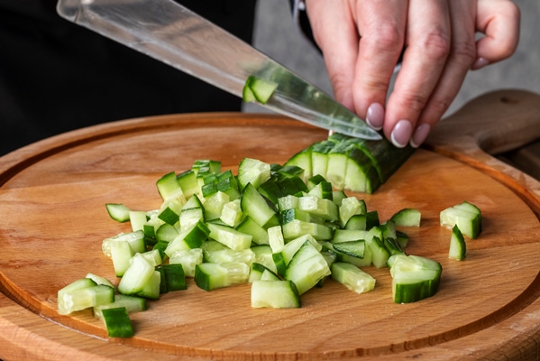 high angle of chef chopping cucumbers - Рассольник с перловкой на зиму