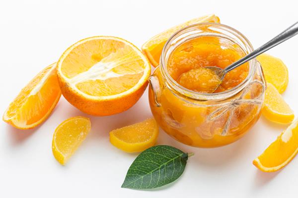 high angle orange jam in jar - Постные гречневые блины с джемом