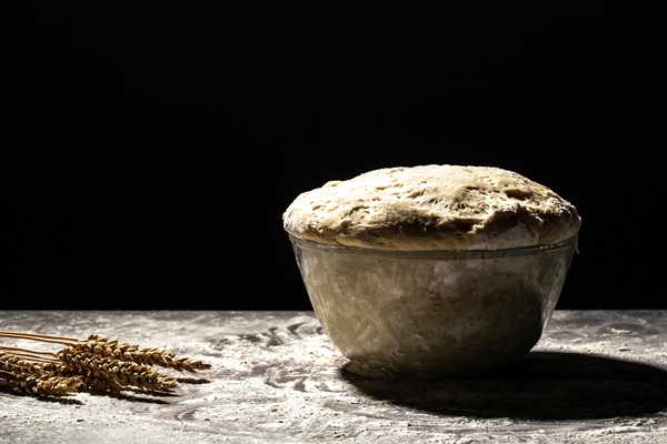 large metal bowl with dough in it with flour - Жаворонки ко дню 40 мучеников Севастийских