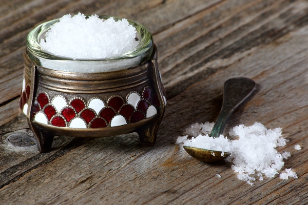nutritional salt in an old salt cellar on a gray wooden table - Блинцы пшенично-ржаные постные