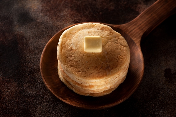 pancakes with butter on a wooden pan - Постные закусочные блинцы на соевом молоке