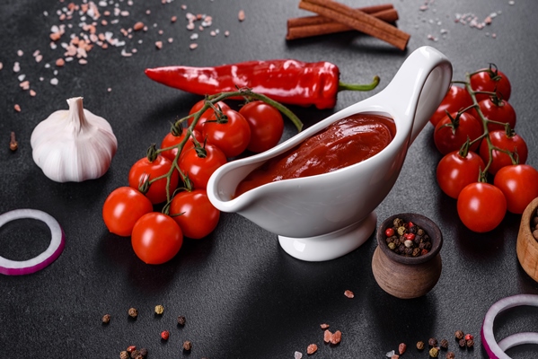 red sauce or ketchup in a bowl and ingredients for cooking - Борщевая заправка на зиму
