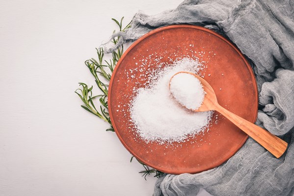 salt in a wooden spoon on a plate on a wooden background top view free space for - Хе из баклажанов и капусты на зиму (без стерилизации)
