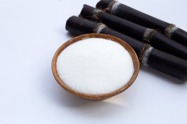 sugar cane with sugar on white background - Постные гречневые блины с джемом