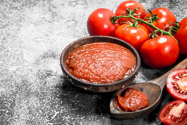 tomato sauce in a wooden bowl on rustic background 1 - Солянка грибная на зиму