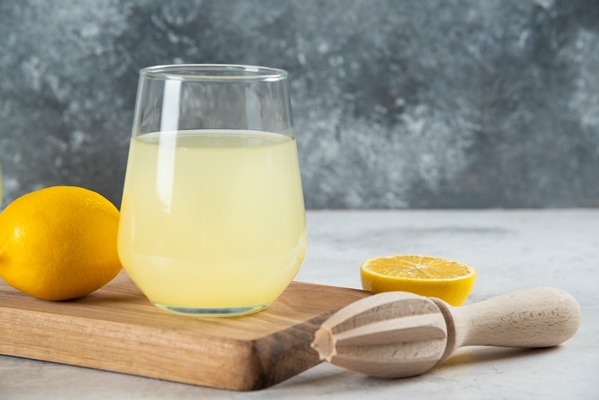 a glass cup of lemonade and wooden reamer 1 - «Зелёный» суп с крапивой