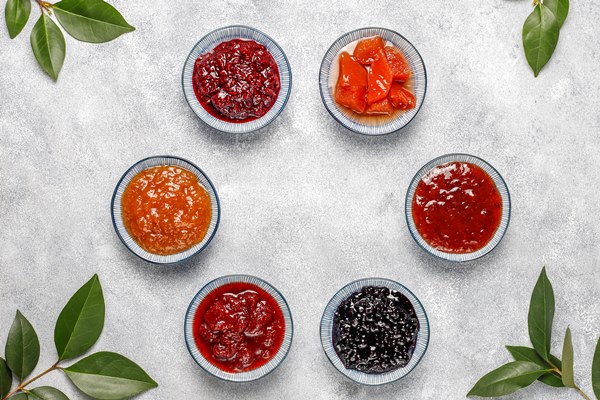 assortment of sweet jams and seasonal fruits and berries top view 1 - Пирог или пирожки с вареньем