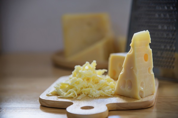 beautiful cheeses in the kitchen cheese food preparing concept - Морковный салат с сыром и чесноком