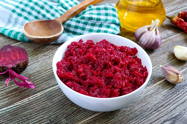 beetroot caviar simple tasty and healthy vegetable snack in a white bowl on a wooden table lenten menu - Свекольная икра