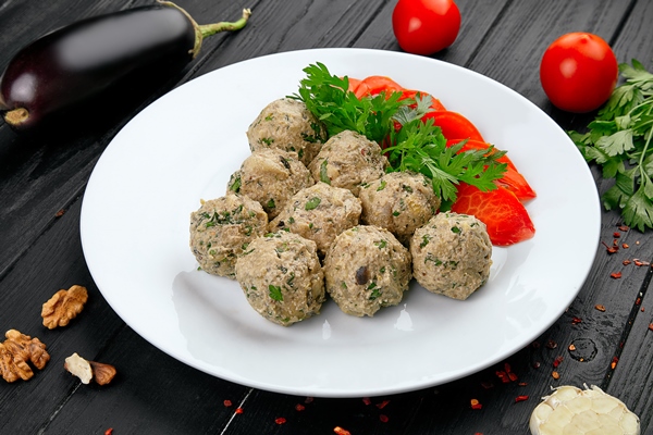 close up view on phali ball made from nuts and eggplant raditional georgian snack with vegetables vegan food healthy dieting concept with copy space - Грузинский салат (без масла)