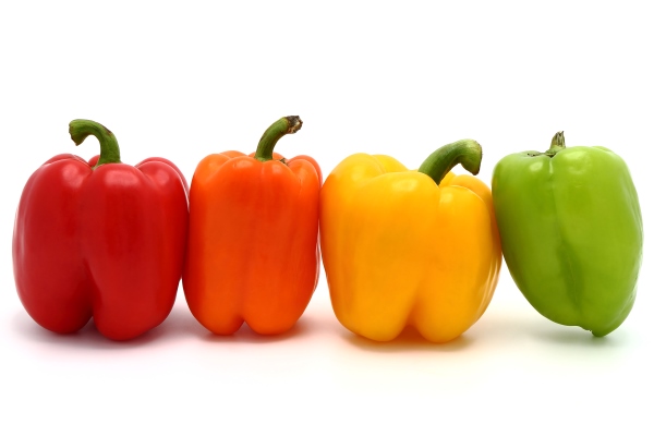 colored bell peppers on a white background - Сладкий перец жареный