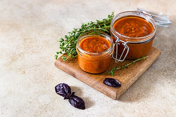 delicious vegetable caviar in jars thyme and purple basi - Икра из репчатого лука