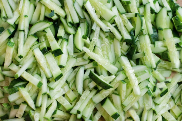 finely chopped fresh cucumbers in strips with a solid background - Салат "Осенний"