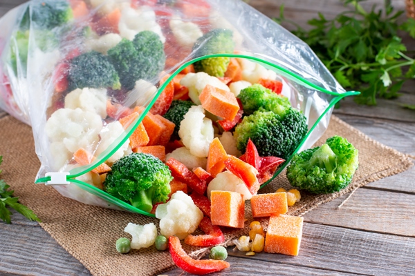 frozen vegetables in plastic bags on a table frozen food - Суп с корневищами иван-чая