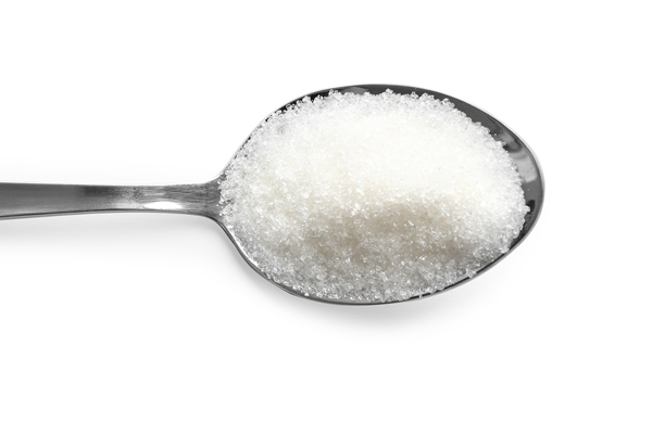 granulated sugar in spoon isolated on white top view - Крапивный соус 