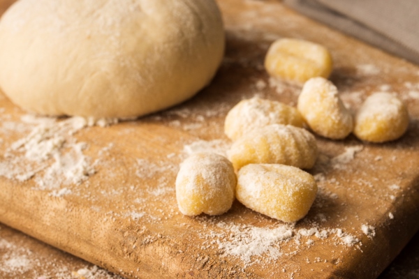 high angle dough and potato gnocchi on cutting board - Постный суп грибной с галушками