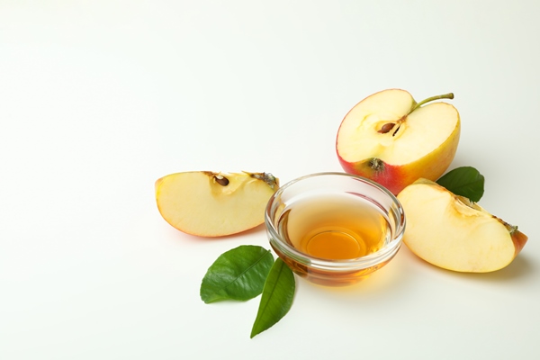 homemade apple vinegar and ingredients on white - Салат из капусты с яблоками