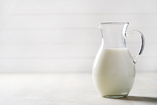 jug of fresh milk with copyspace - Домашний творог