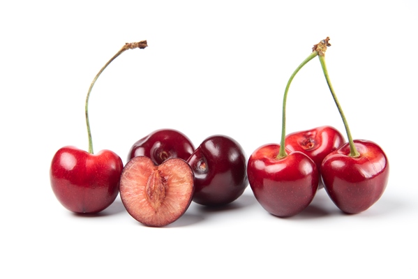 red and black cherries on white background - Вишнёвые вареники с сиропом