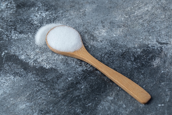 salt in a wooden spoon on a marble background 1 - Кисло-сладкий постный соус