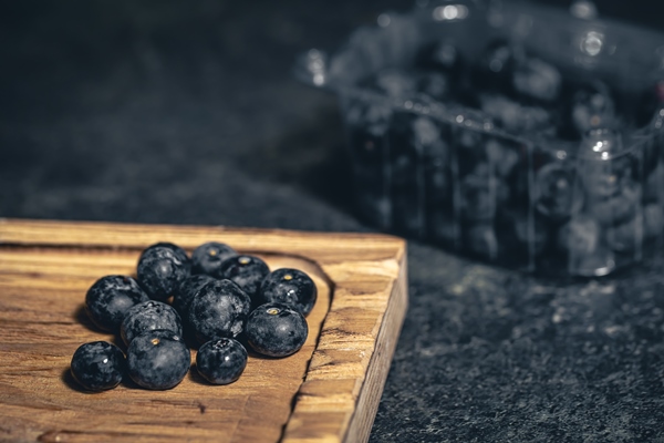 blueberry berries closeup on a dark blurred background 1 - Черника дроблёная с сахаром