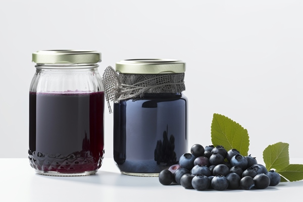 blueberry jam and plump blueberries fruit jars on white background with generative ai 1 - Пюре из черники