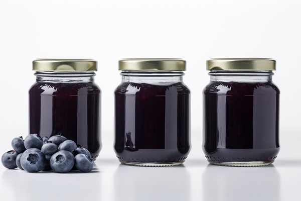 blueberry jam and plump blueberries fruit jars on white background with generative ai - Черничный сок консервированный