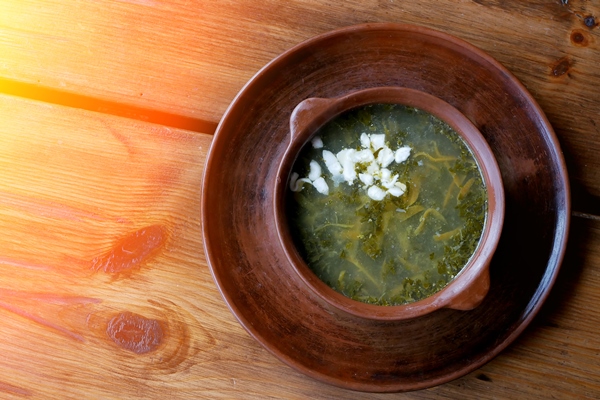 diet sorrel soup with egg on a wooden table - Постный суп из щавеля и свекольной ботвы