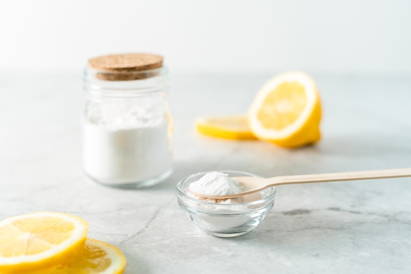 eco friendly natural cleaners jar with baking soda lemon and wooden spoon on marble table background 1 - Варенье из черники