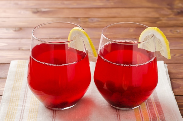 glass of cranberry fruit drink traditional russian compote of cranberries mors - Квас клюквенный
