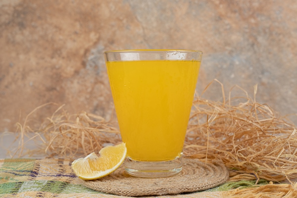 glass of lemonade with lemon slice on tablecloth - Суп из сухофруктов