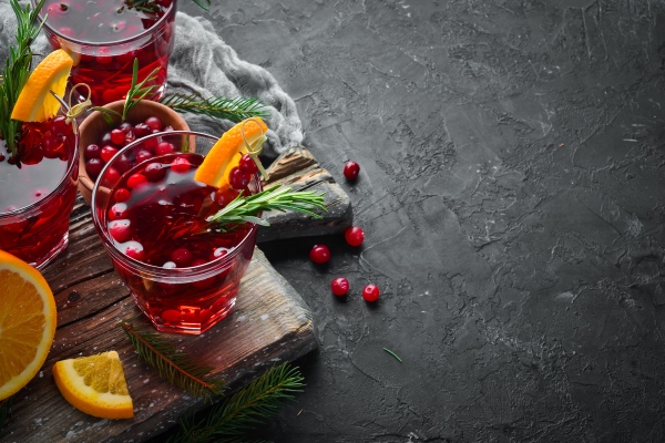 glasses with cranberry juice cranberries limes rosemary on a rustic background top view free space for your - Детский квас