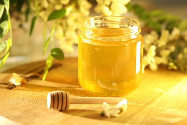 jar of honey with white flowers blossom - Коломенский квас