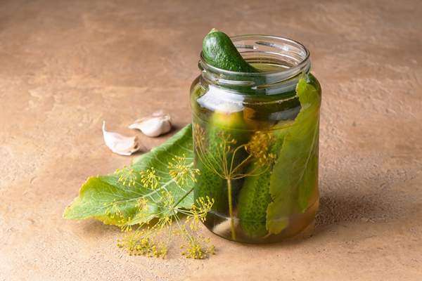 lightly salted cucumbers in a glass jar - Рассольник из рыбы