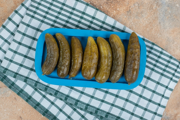 pickled cucumbers on blue plate with tablecloth - Солянка овощная