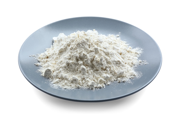 plate with flour on white background - Драники с зеленью и луком