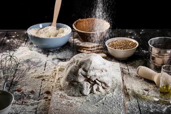 preparing the dough with flour over the table - Бездрожжевой гречневый хлеб