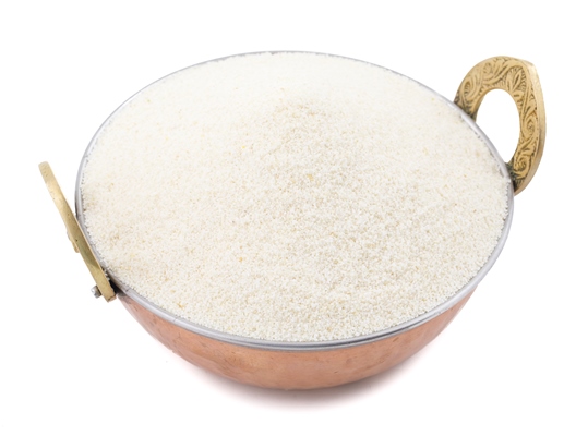 raw unprepared semolina flour or suji on white background - Манный суп