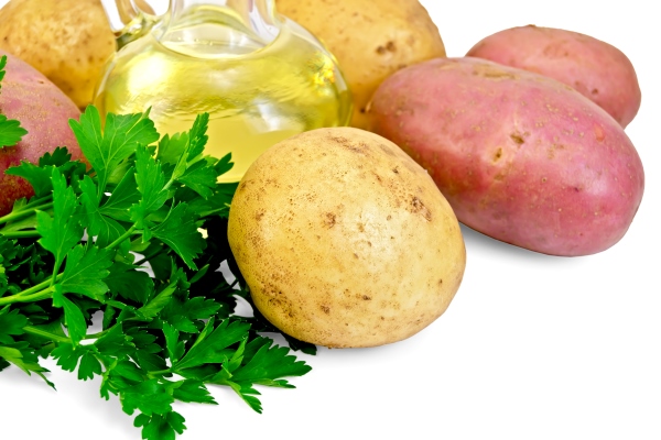 red and yellow potatoes parsley vegetable oil in a bottle isolated on white background - Суп с зелёным горошком
