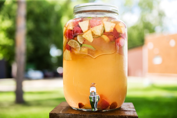 refreshing lemonade with lime strawberry and pineapple in glass jars with tap concept of drinks summer bar rest healthy food horizontal photo - Лечебный квас