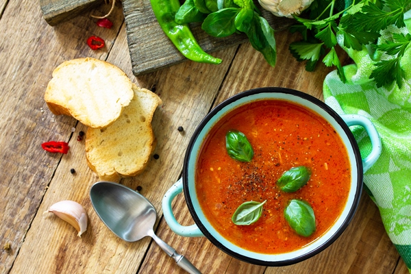 the concept of healthy and diet food vegetarian dish tomato soup or gazpacho soup with croutons - Суп-пюре из помидоров с репой