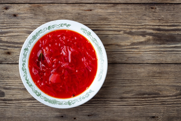 traditional ukrainian vegetarian beet red soup borscht on wooden background top view - Борщ украинский